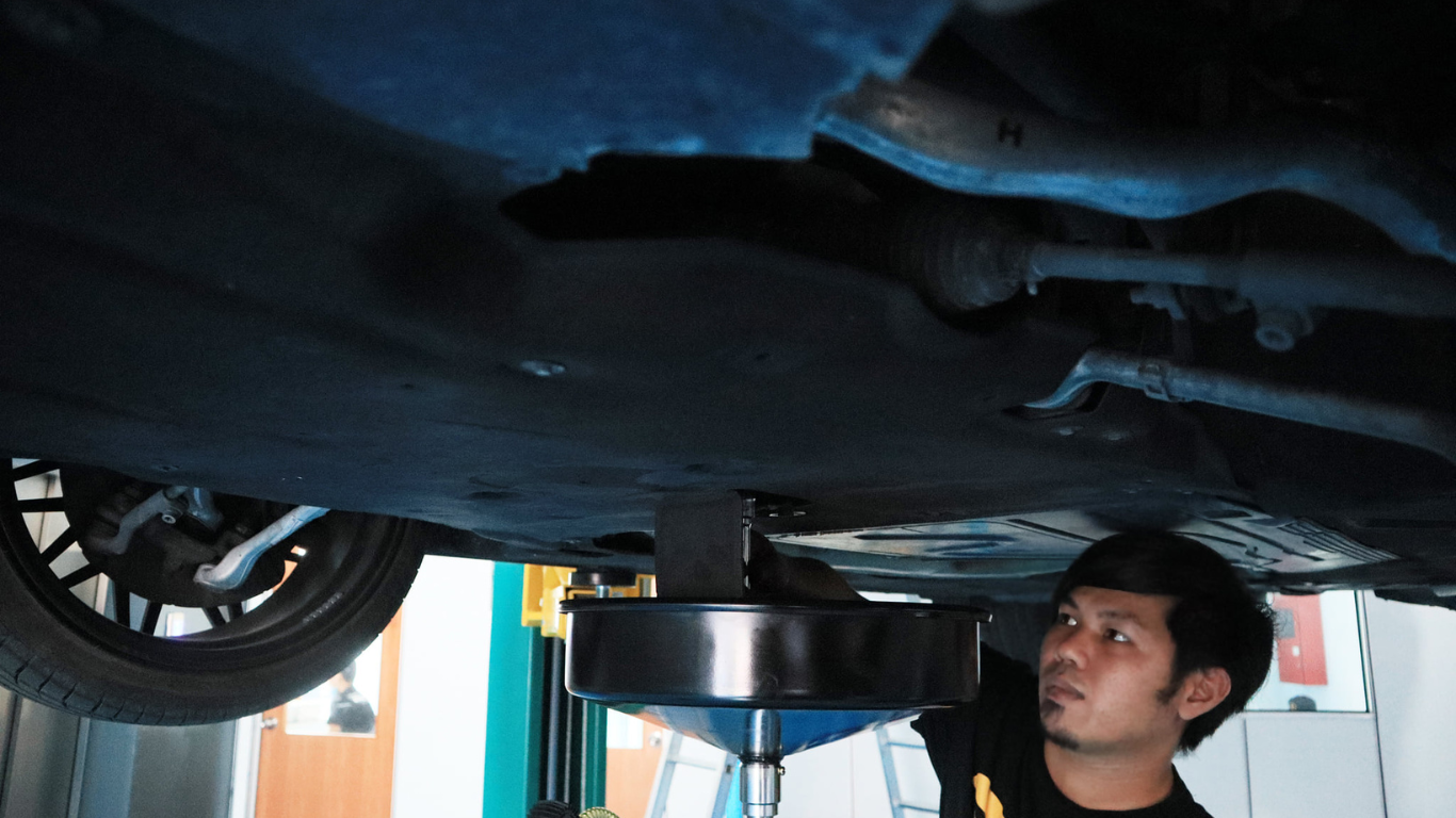 This image placed on (Full Car Inspection) page. It shows one personnel who doing a services towards our customer vehicle