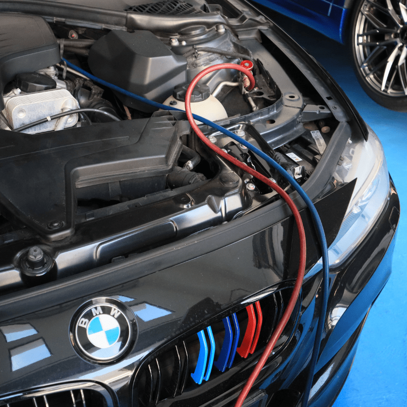 Image place on (Air Conditioning Maintenance) page. Image showing car being maintenance and currently showing coolant gas being refill to the car AC system